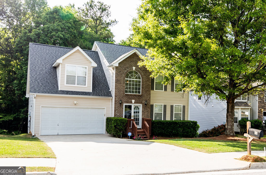 a front view of a house with a yard