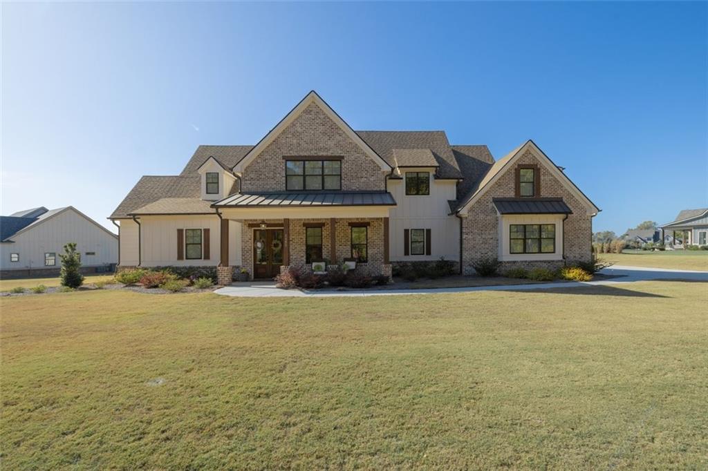 a front view of a house with a yard