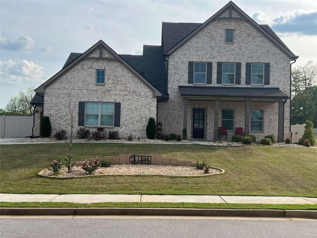 front view of a house with a yard