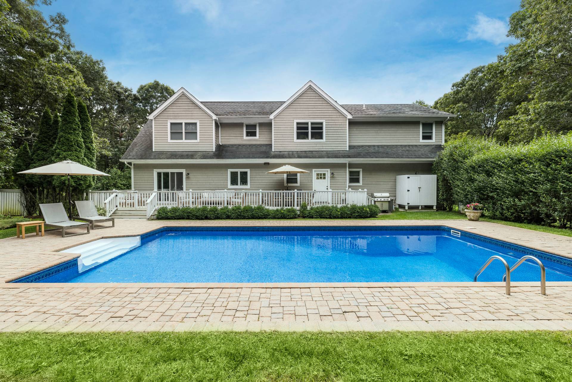 a view of swimming pool with outdoor seating and yard