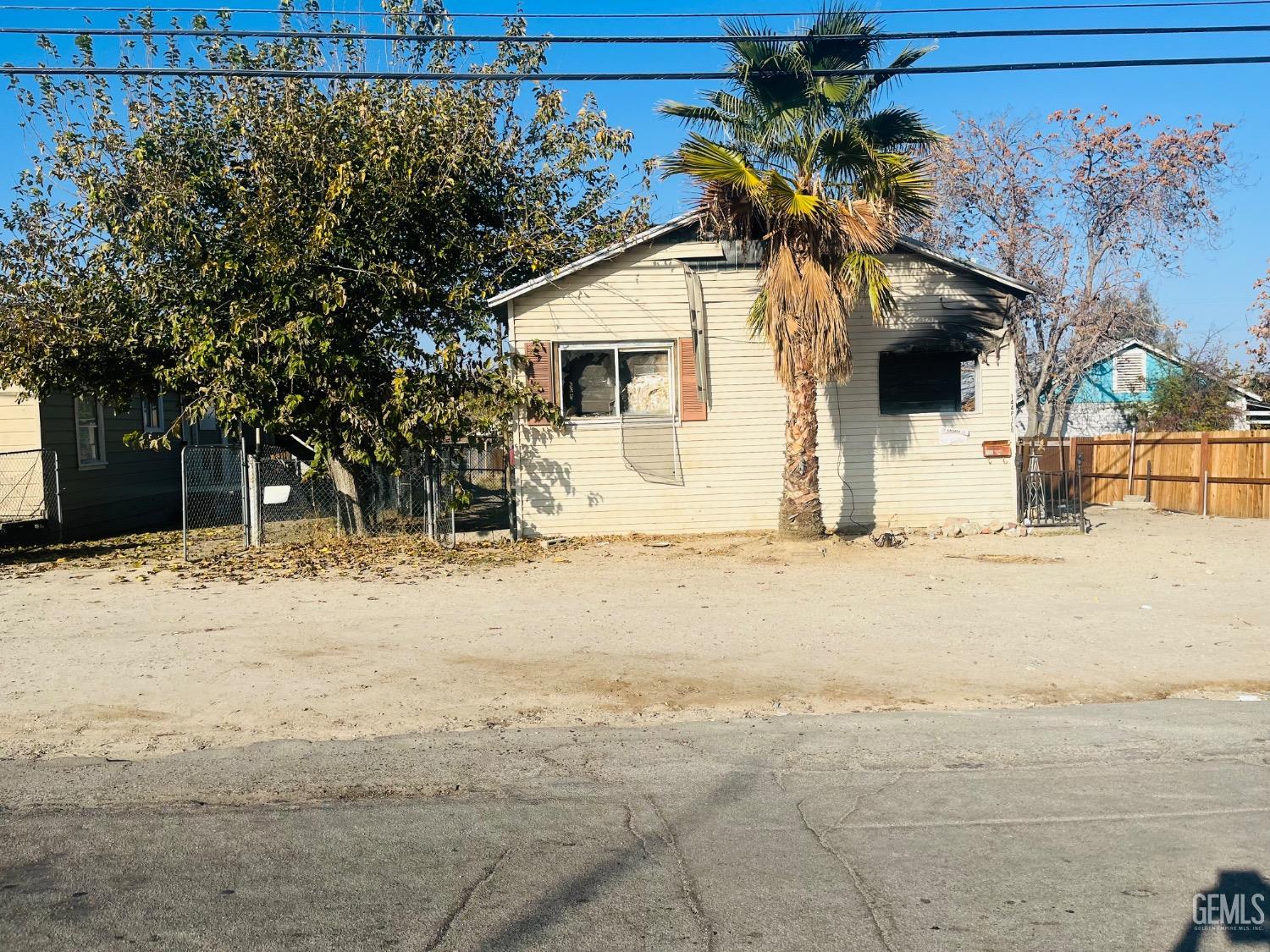 a view of a house with snow on the road