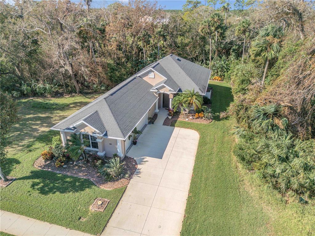 a aerial view of a house with a yard