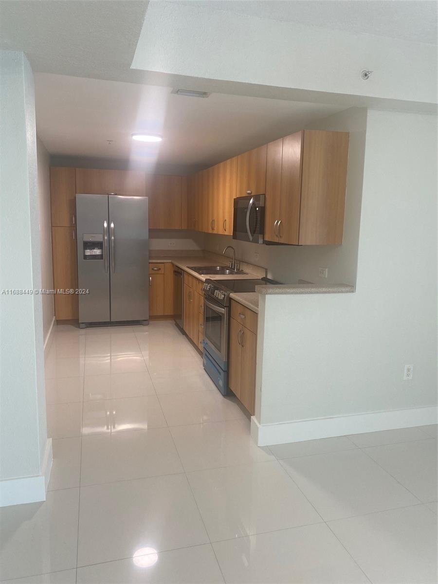 a view of a kitchen with a sink