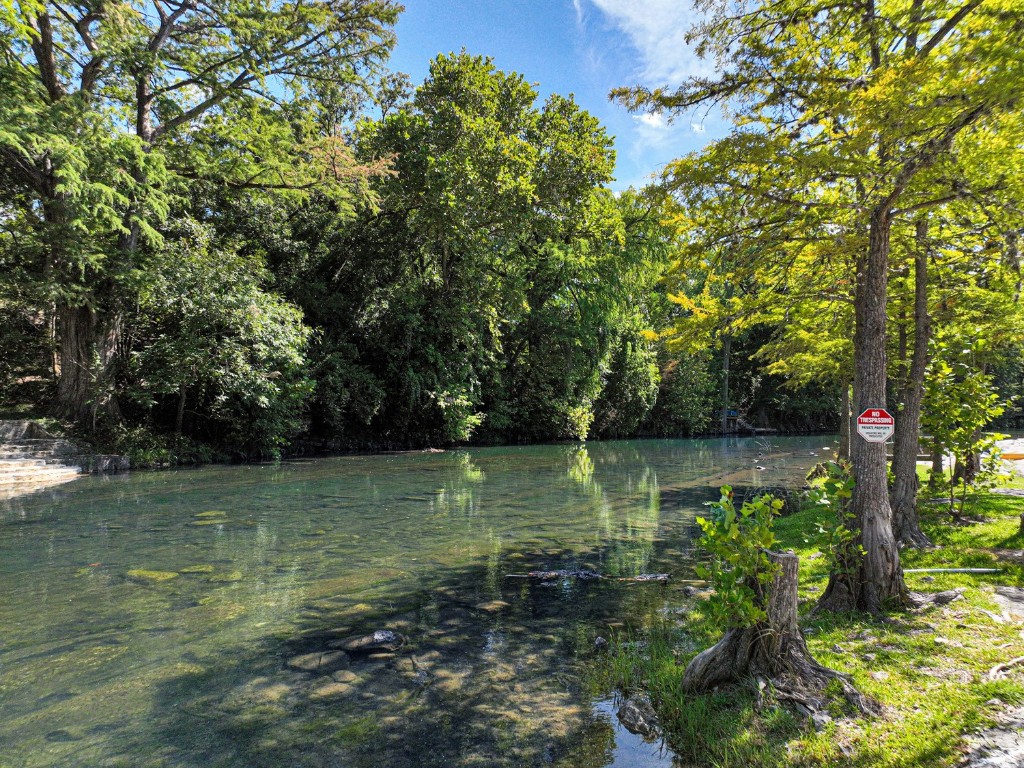 a view of a lake with a yard