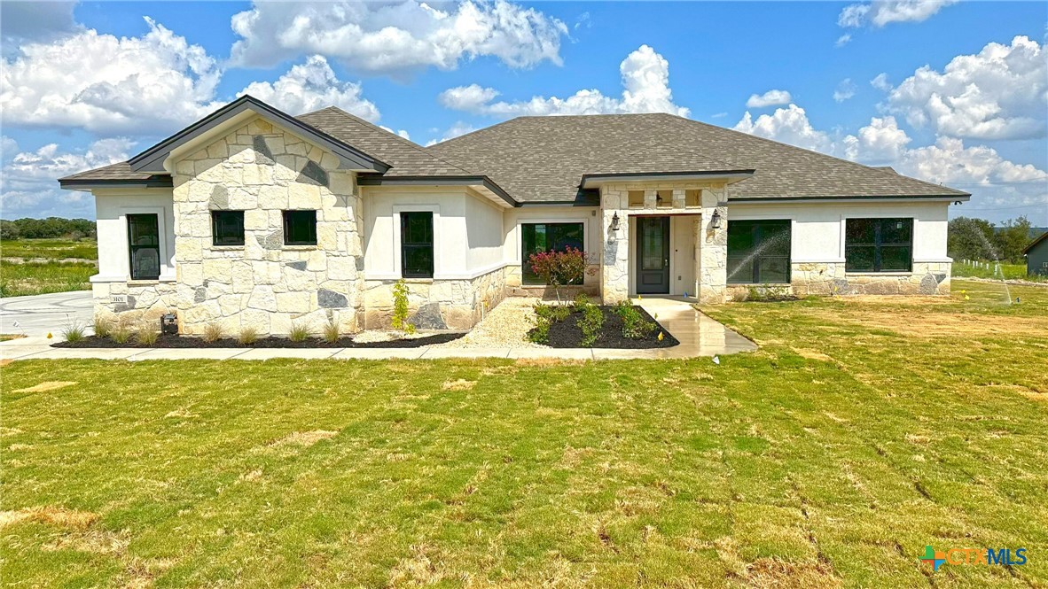 a front view of a house with swimming pool