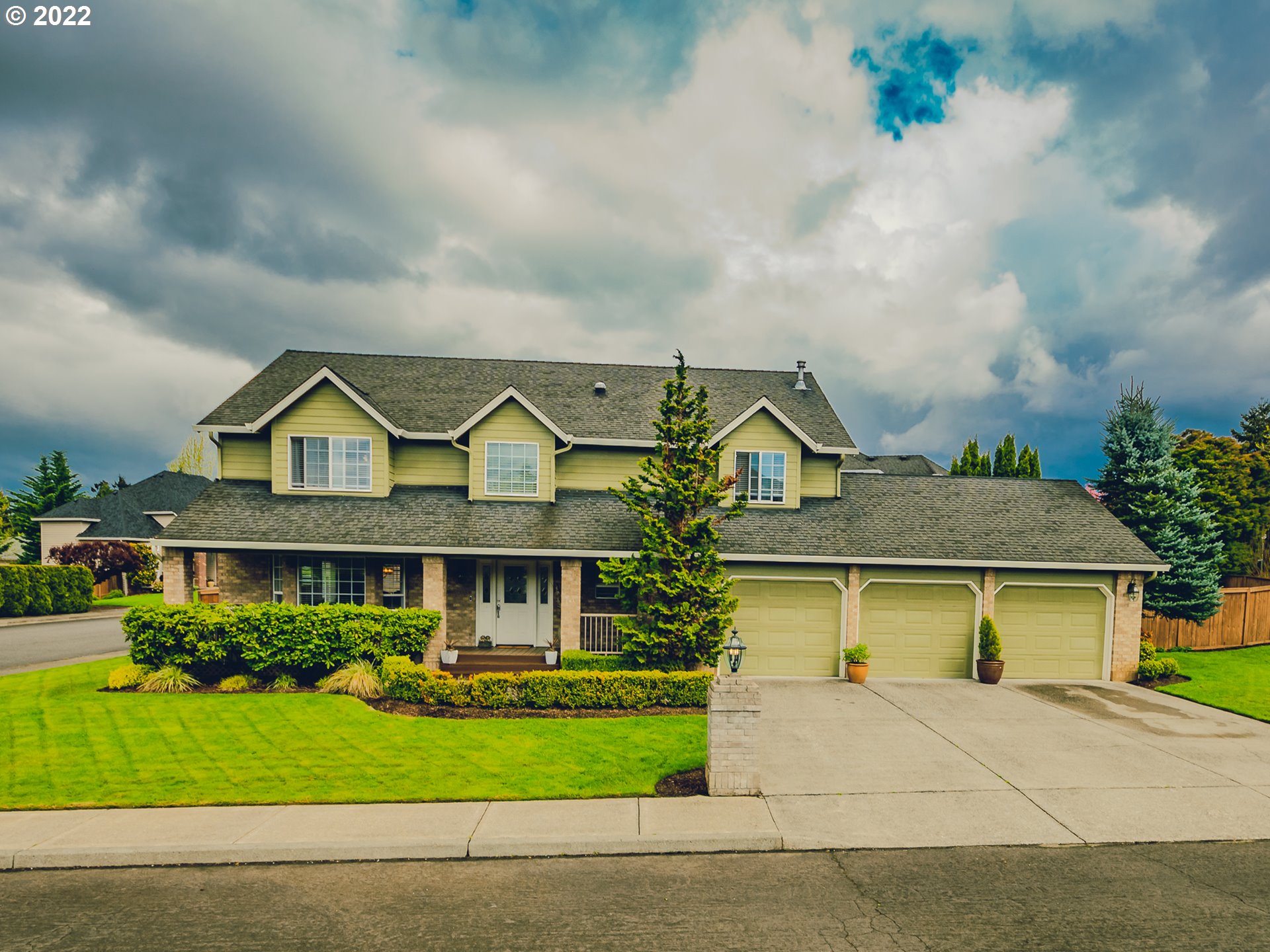 a view of multiple houses with a garden