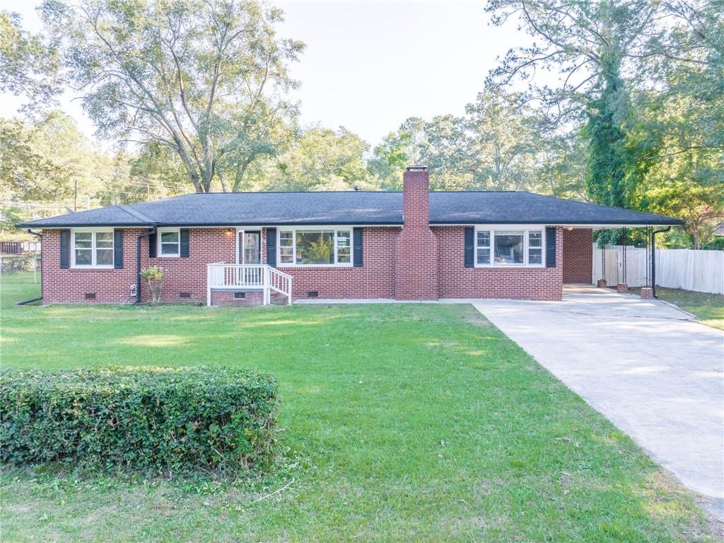 front view of a house with a yard