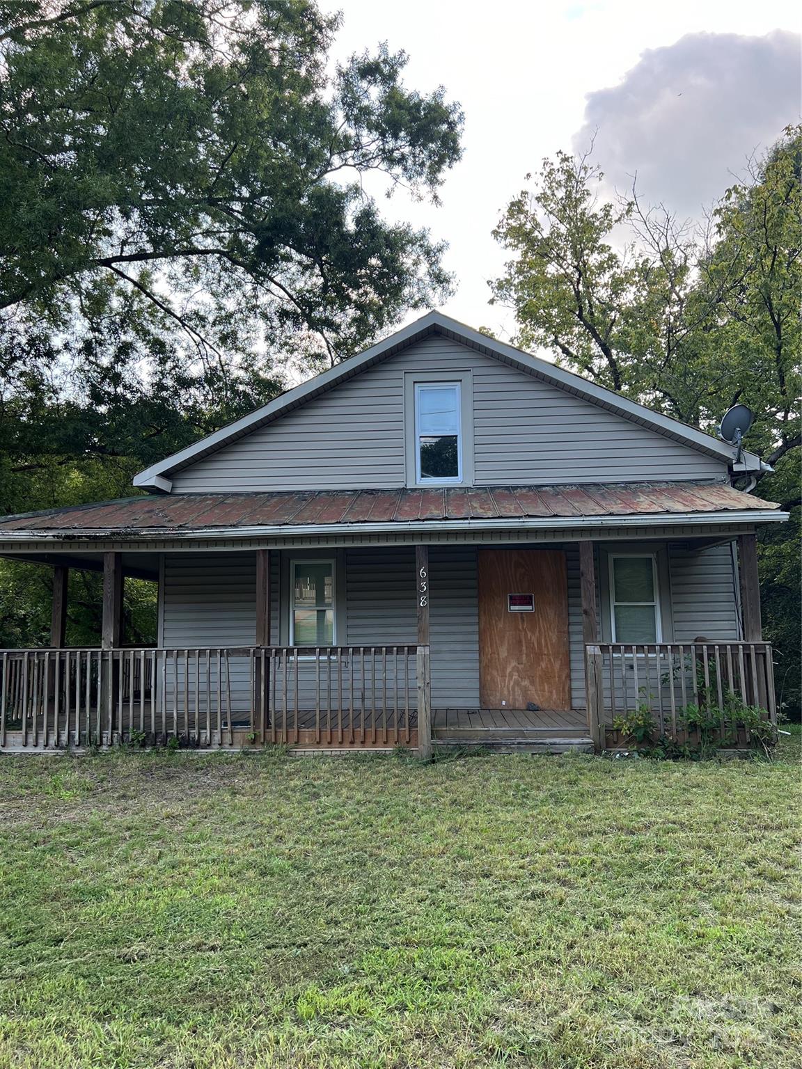 a front view of a house with garage