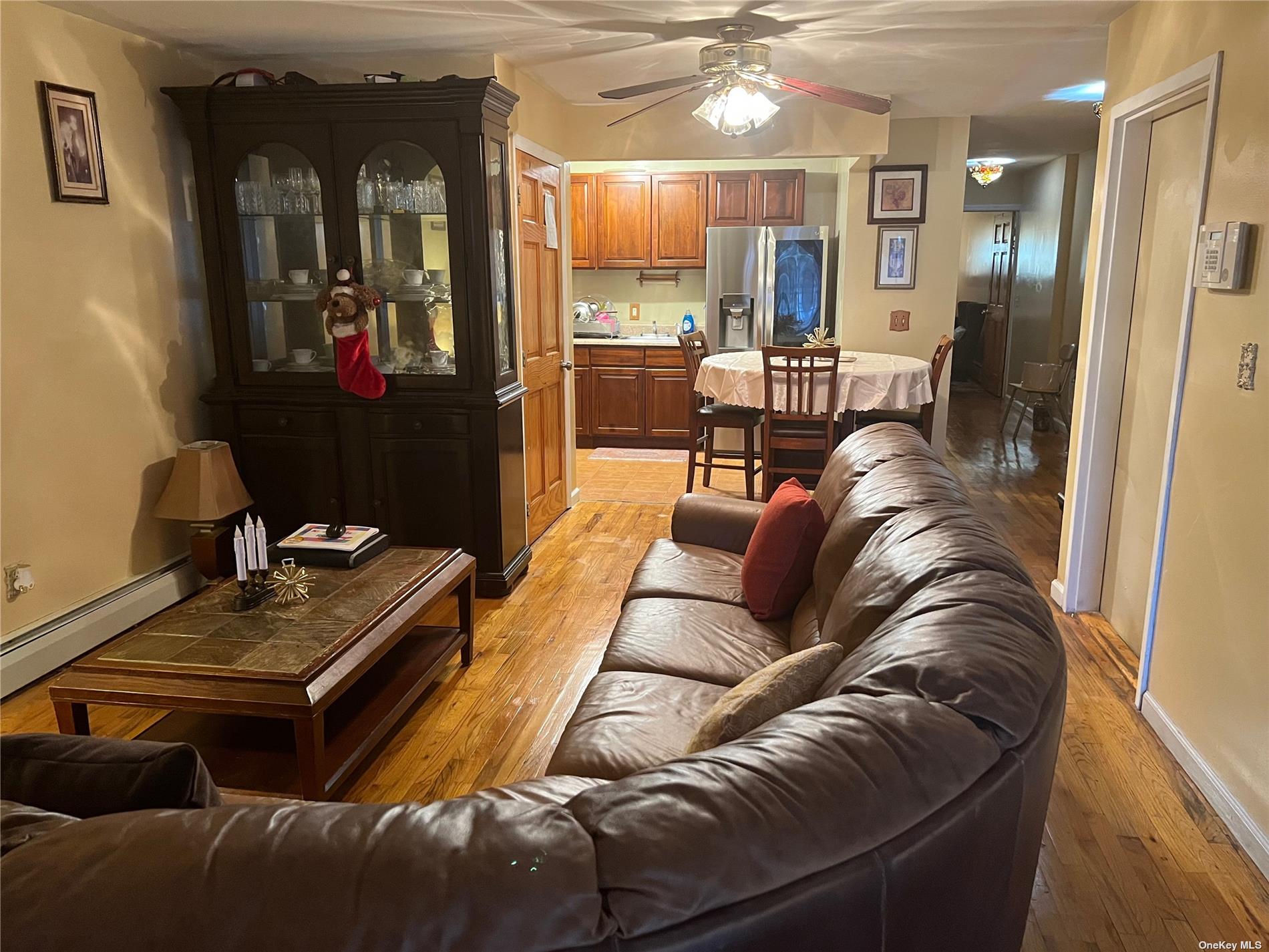 a living room with furniture and a mirror