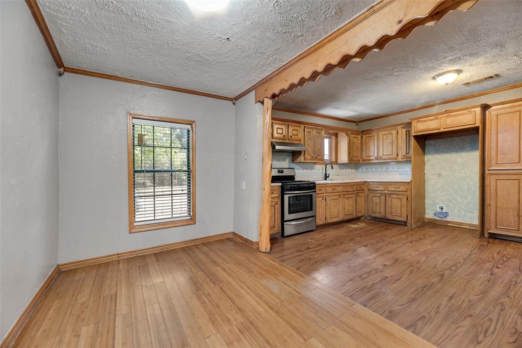 a view of a kitchen with a sink dishwasher and a window