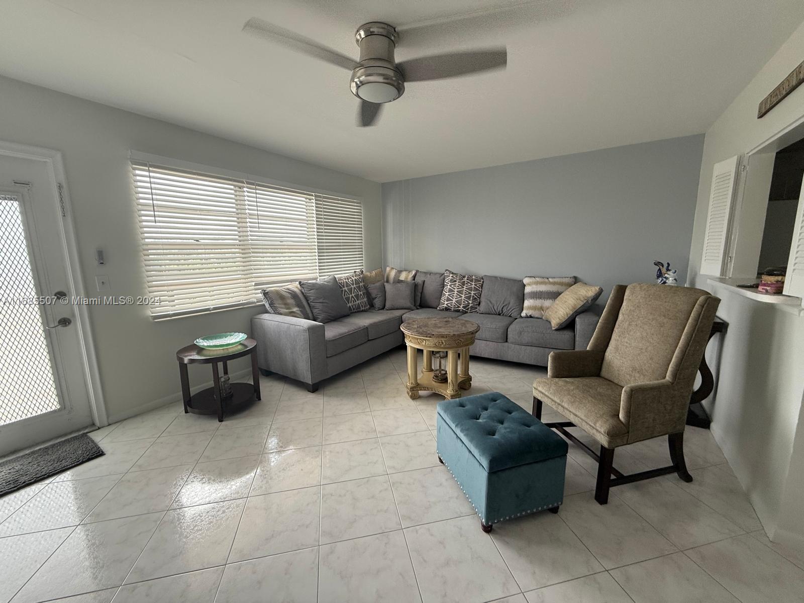 a living room with furniture and a window