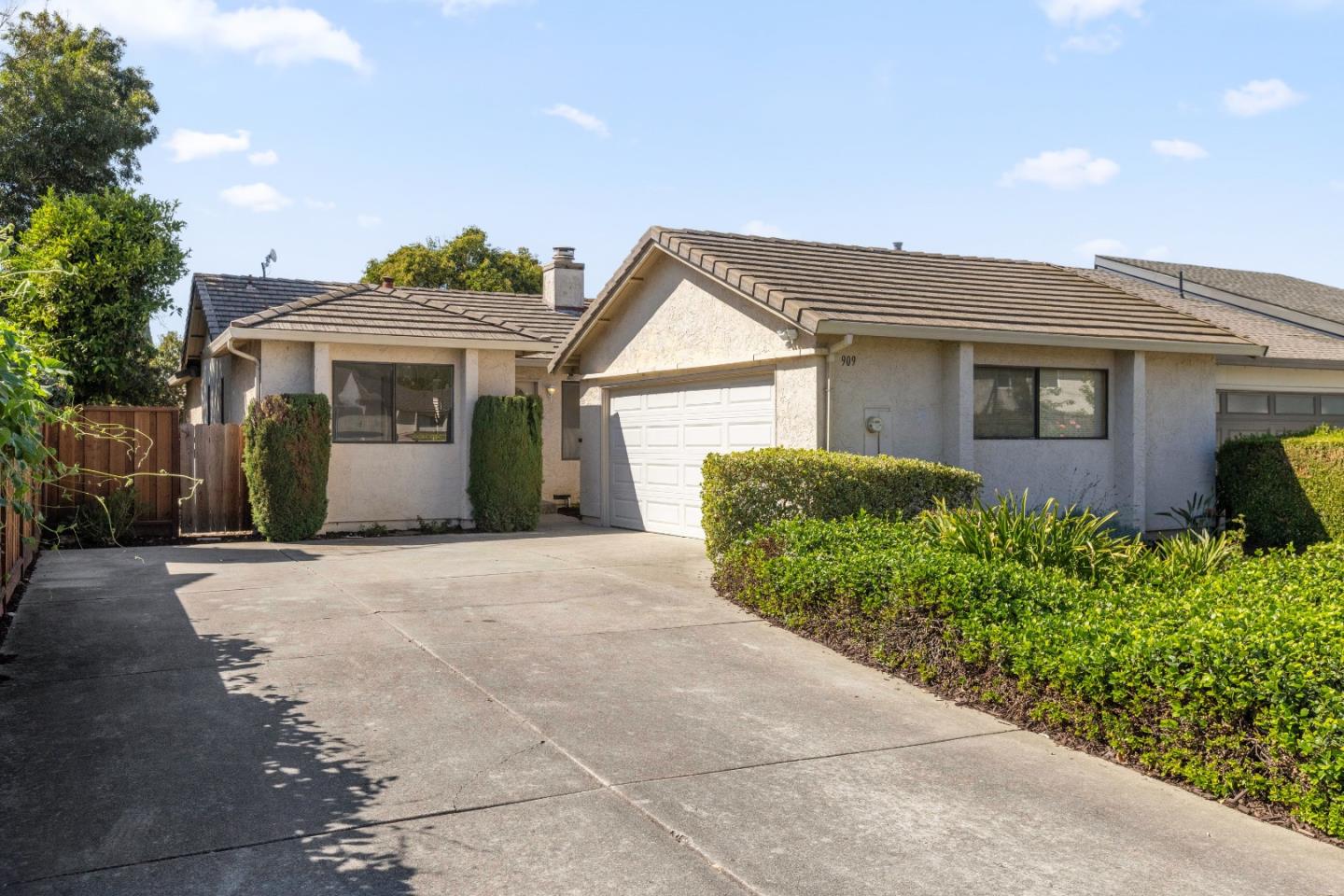 a view of a house with a yard and plants