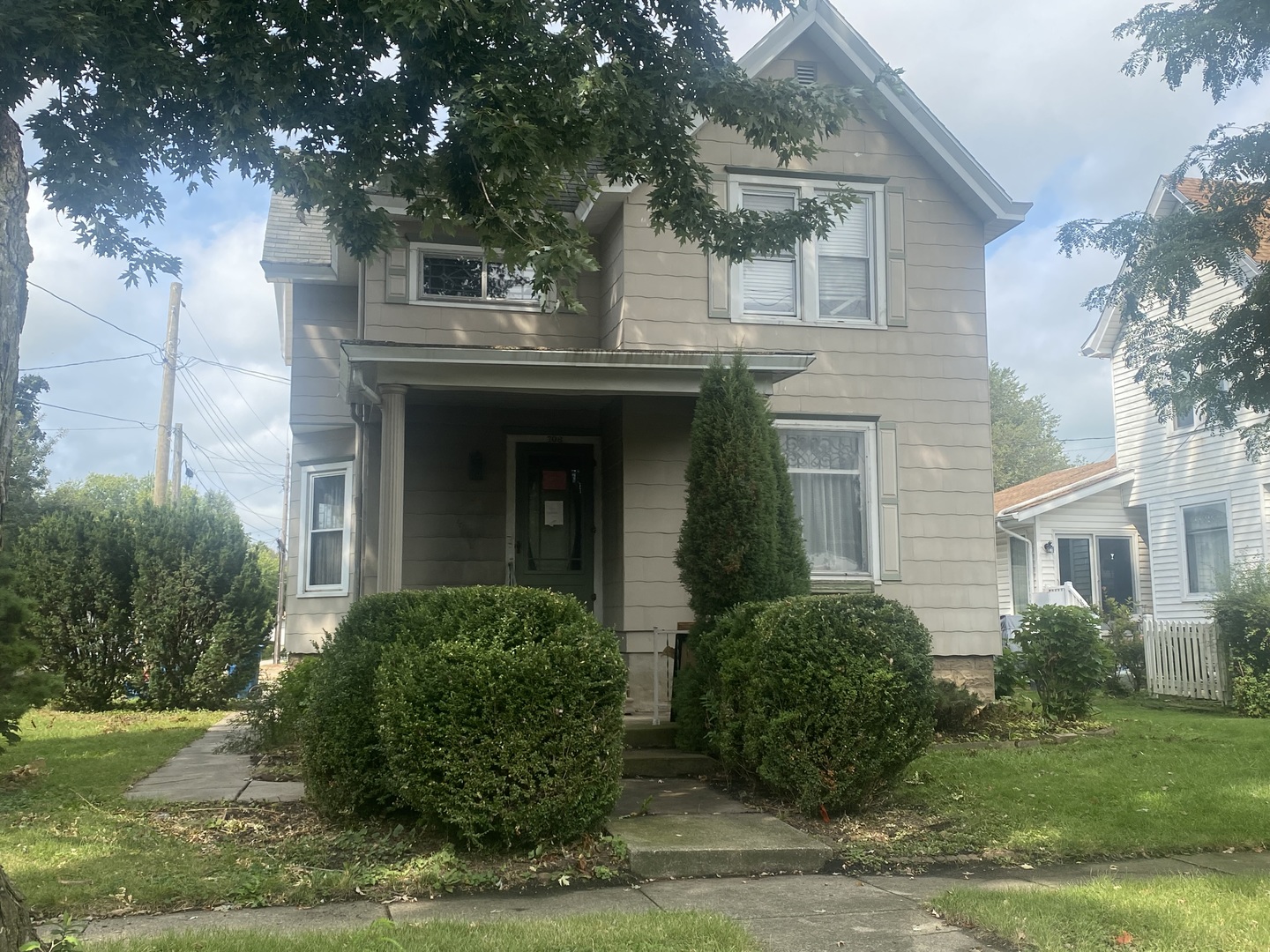 a front view of a house with garden