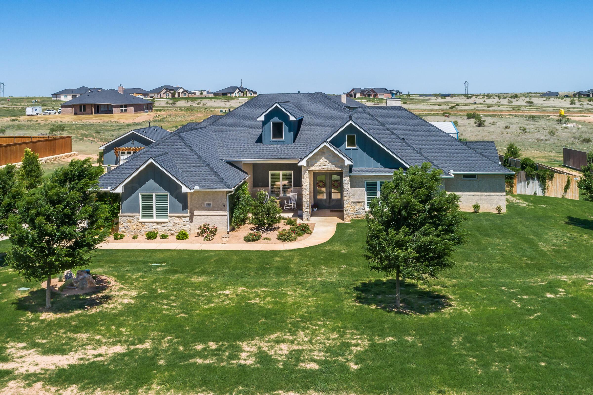 an aerial view of a house with a garden