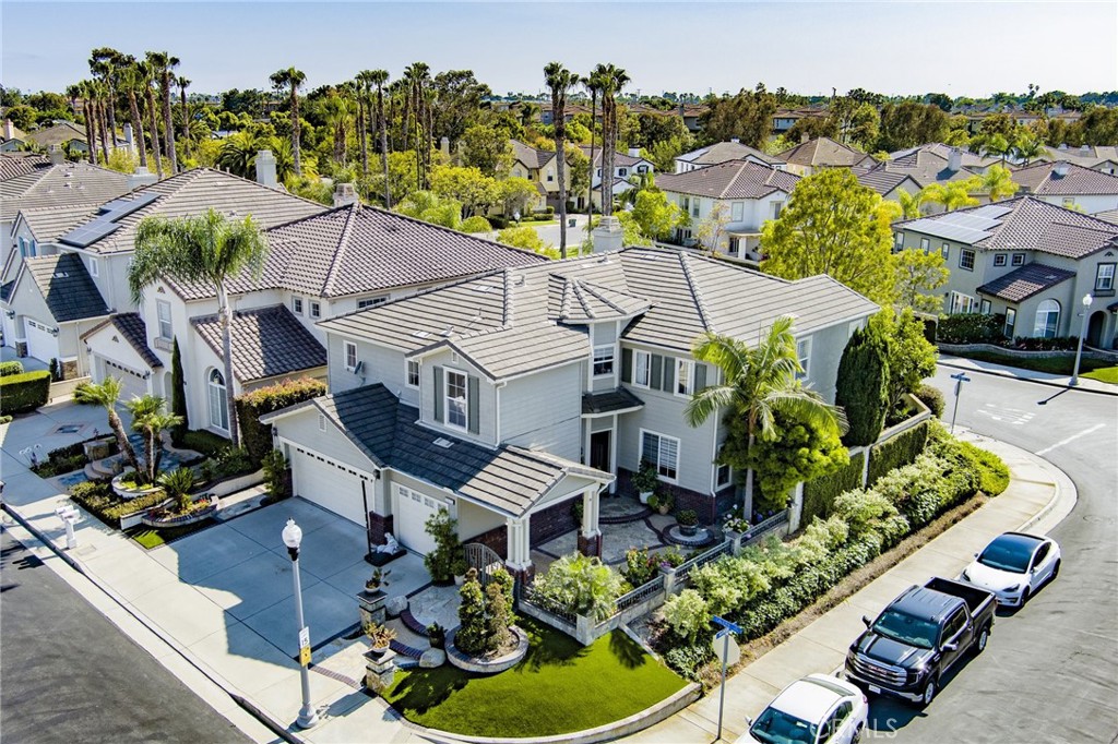 an aerial view of multiple houses with yard