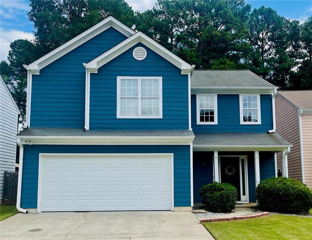 a front view of a house with yard