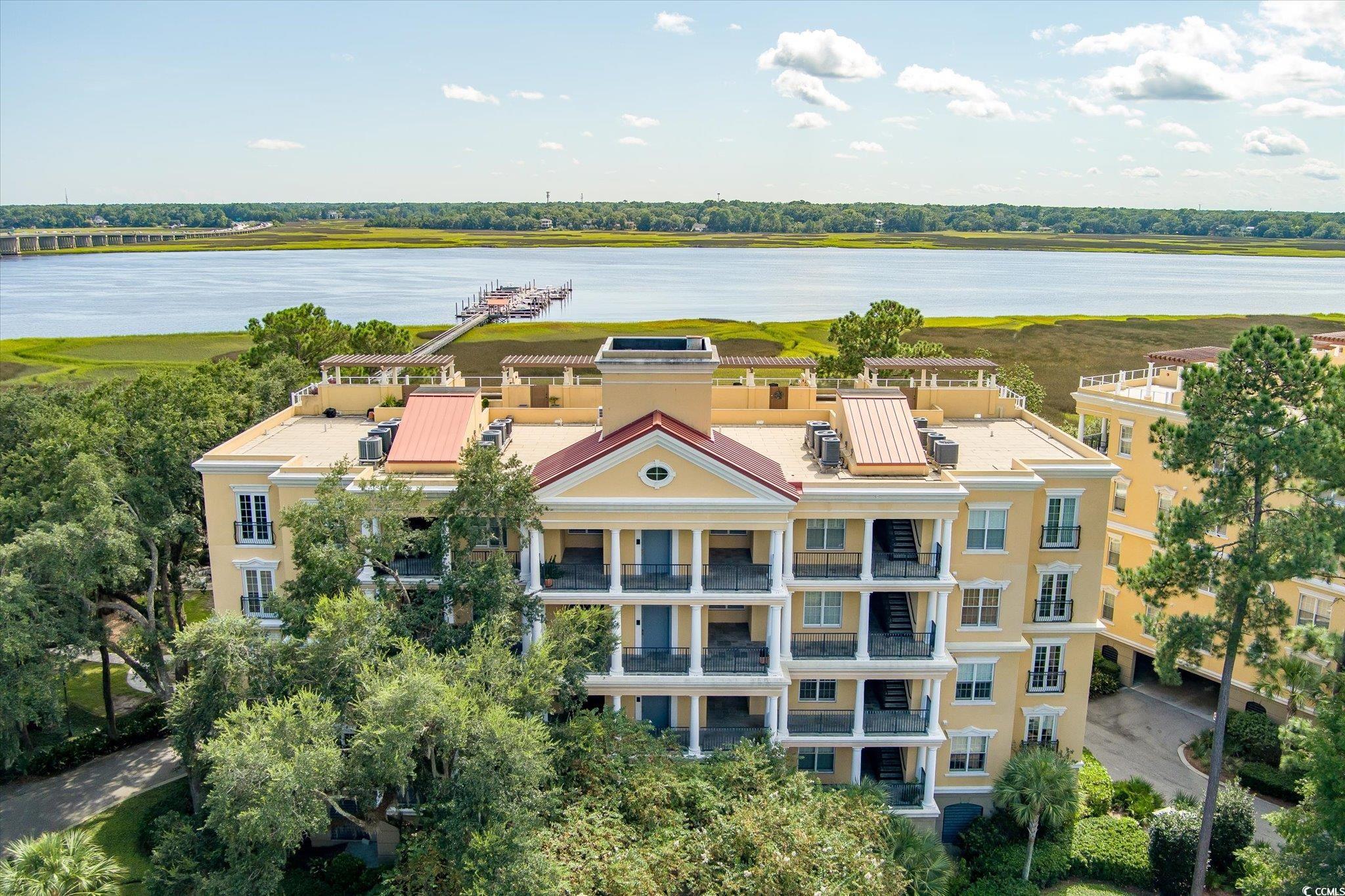 Birds eye view of property featuring a water view