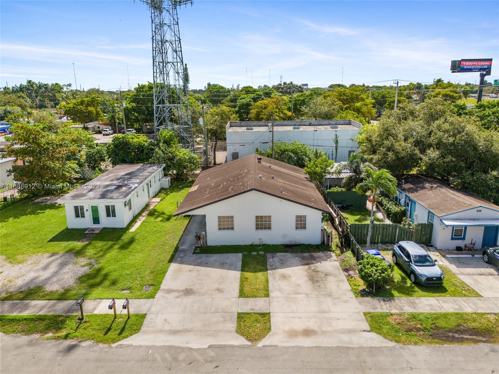 a view of multiple houses with a yard