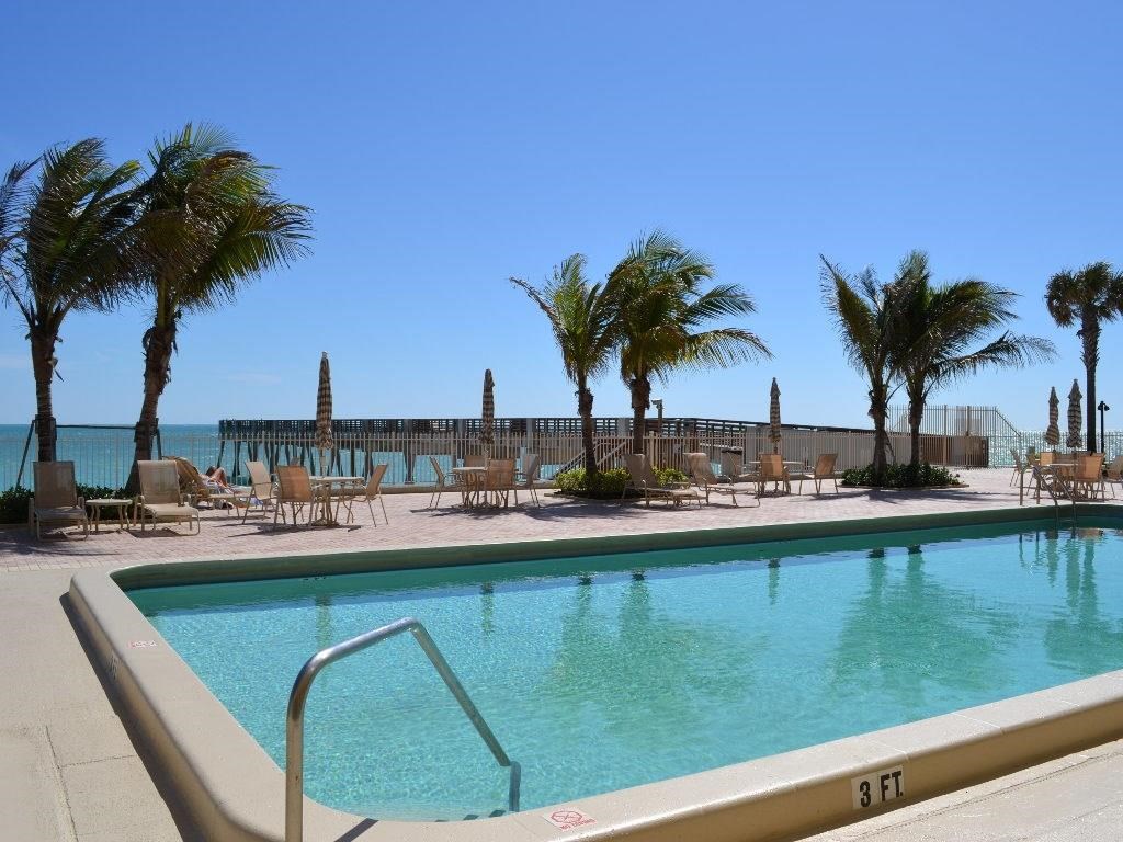 a view of a swimming pool with a lake view