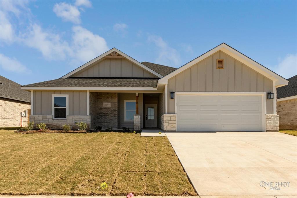 a front view of a house with yard