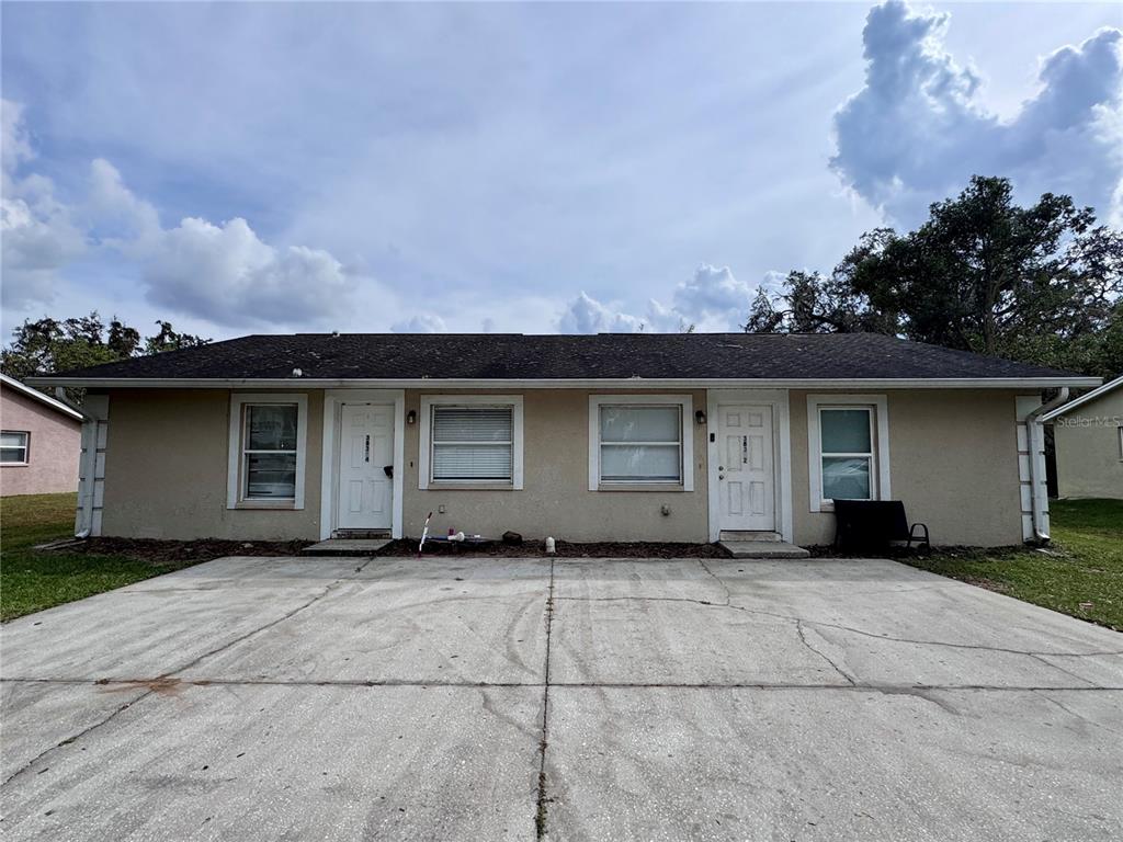 a front view of a house with a garage