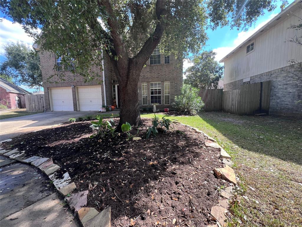 a backyard of a house with yard and outdoor seating