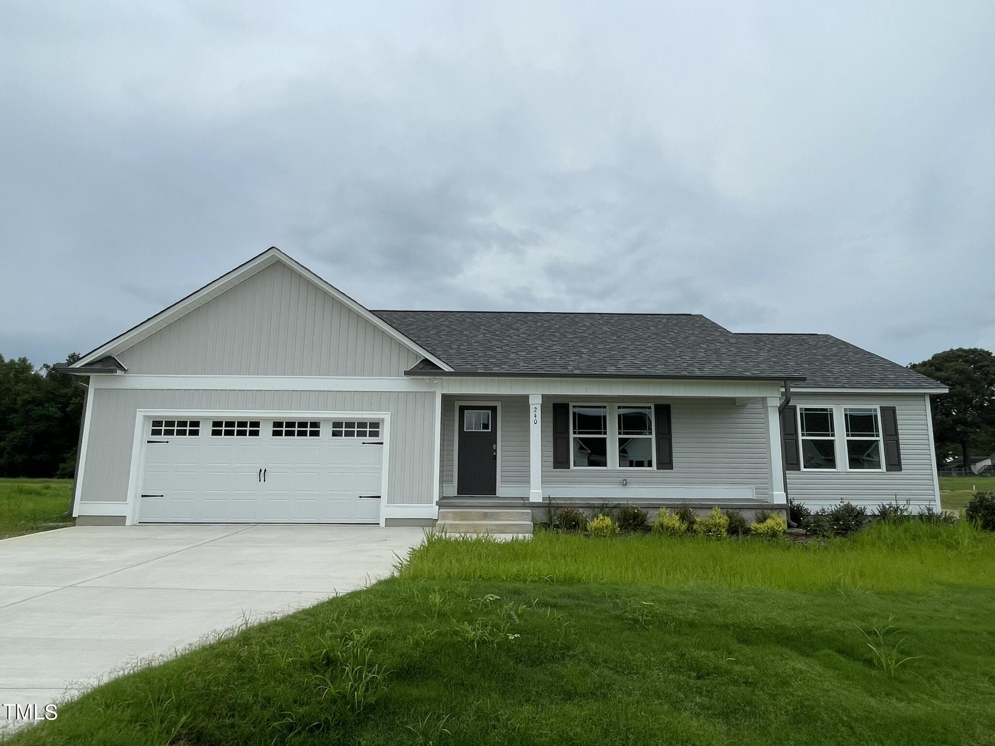 a view of front of house with a yard