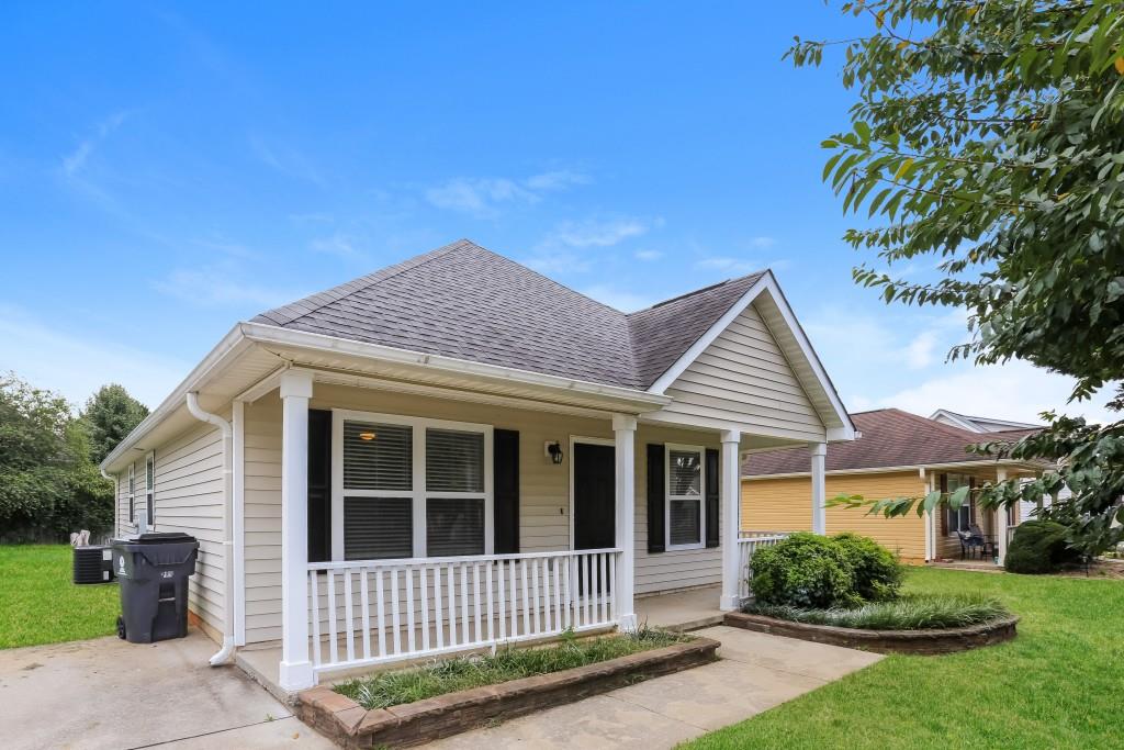 front view of a house with a yard