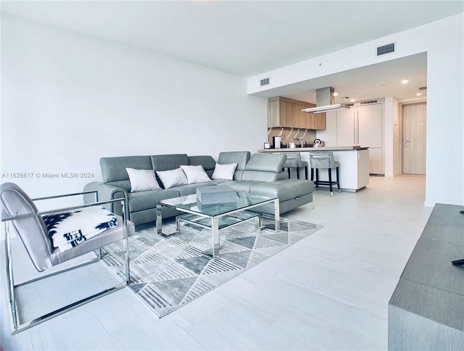 a living room with furniture and a table