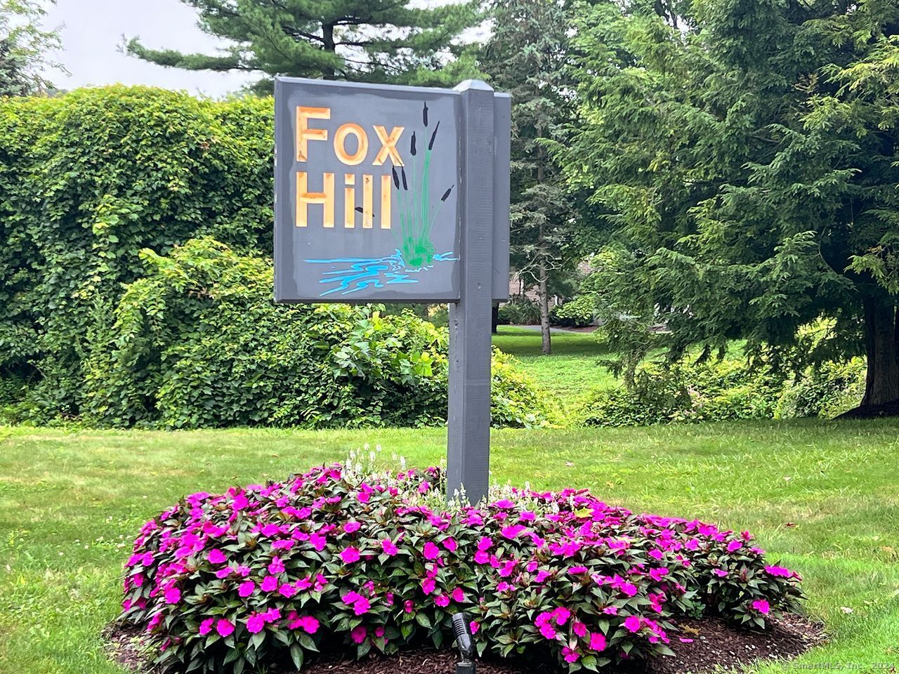 a view of a sign board with a big yard