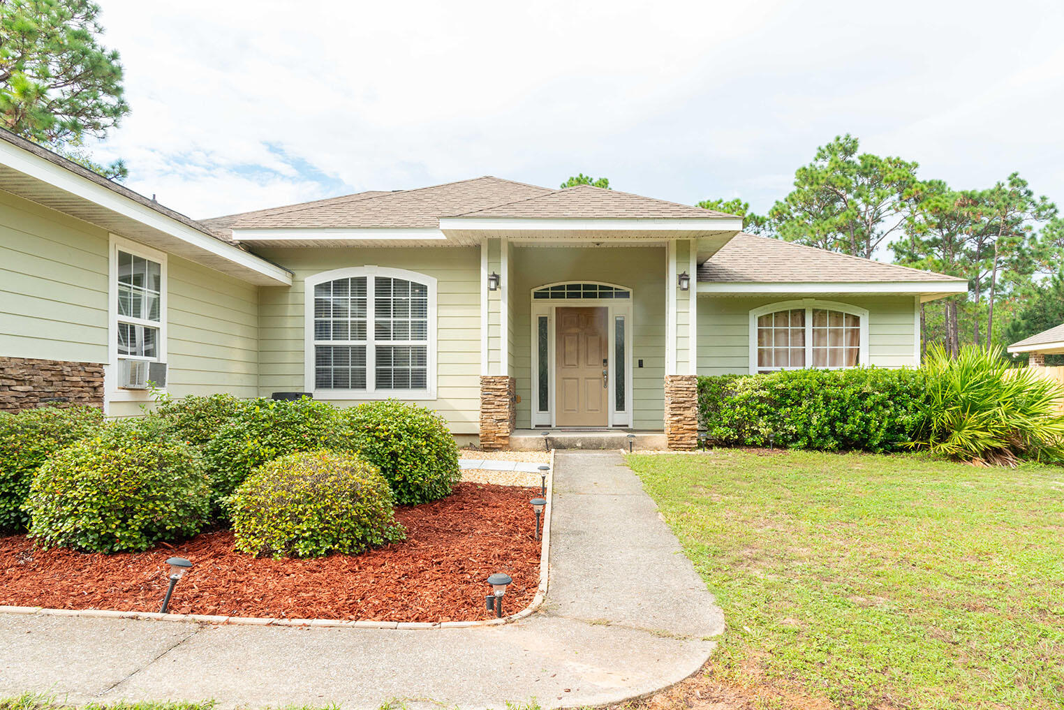 front view of a house with a yard