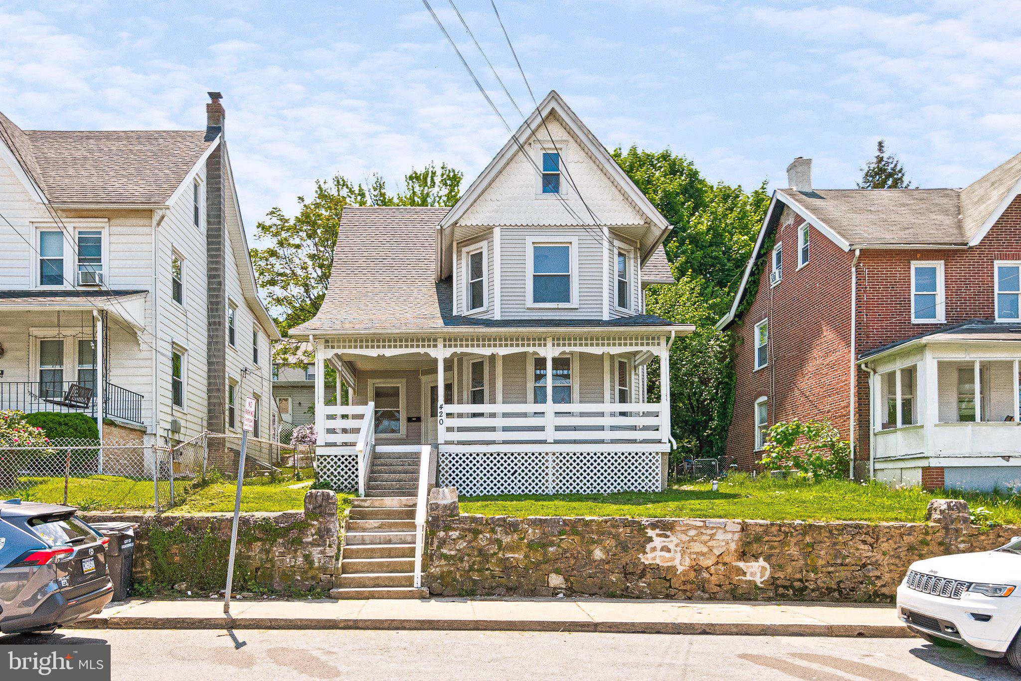 front view of a house with a street