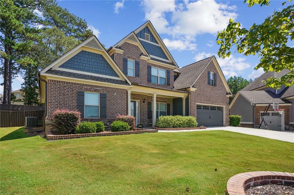 a front view of a house with a yard