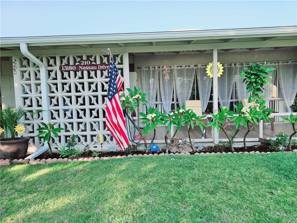 a view of front door and potted plants