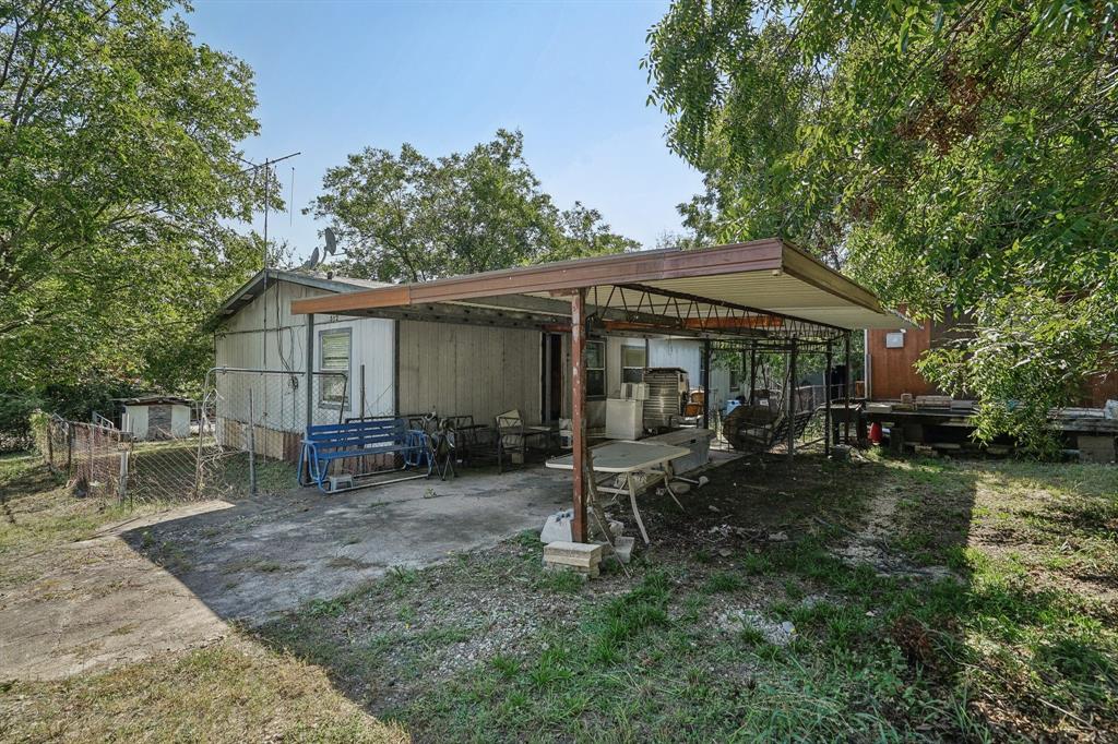 a view of house with backyard space and garden