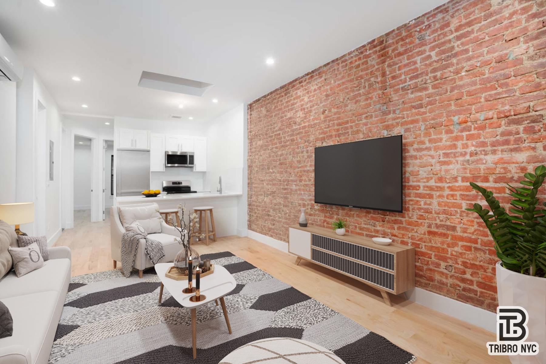 a living room with furniture a flat screen tv and a fireplace