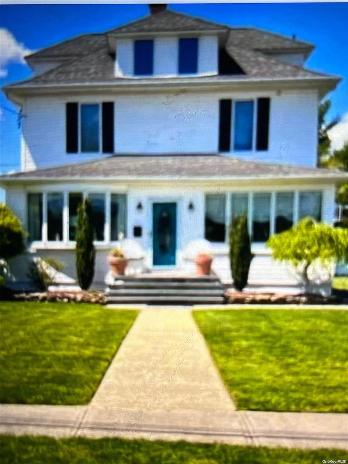 a view of house with a swimming pool