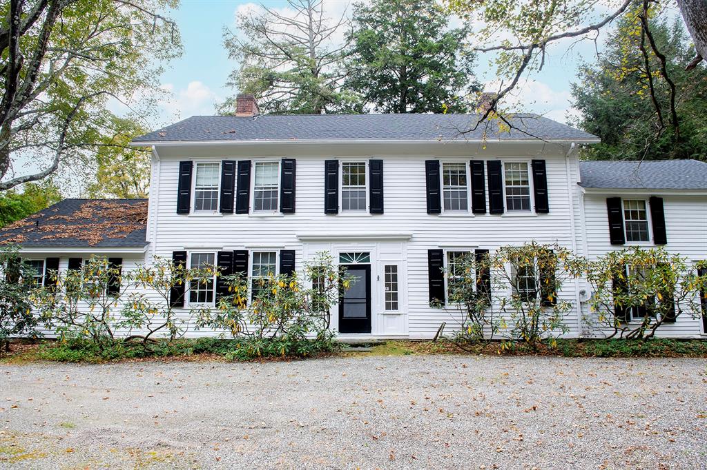 front view of a house with potted plants