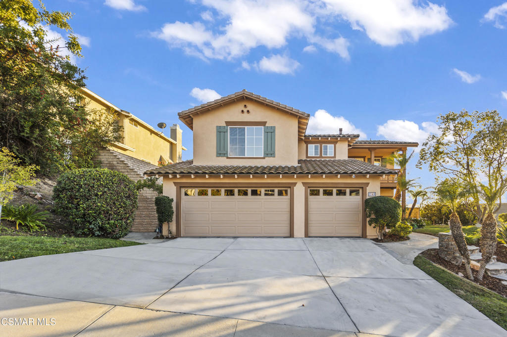 a front view of a house with a garage