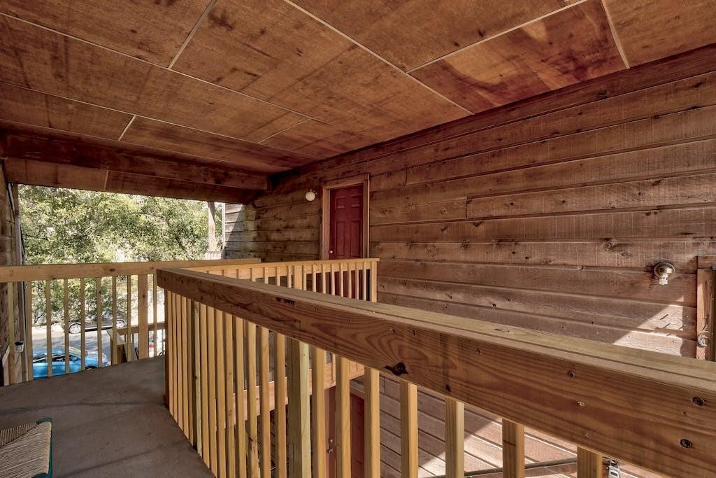 a view of balcony with wooden floor