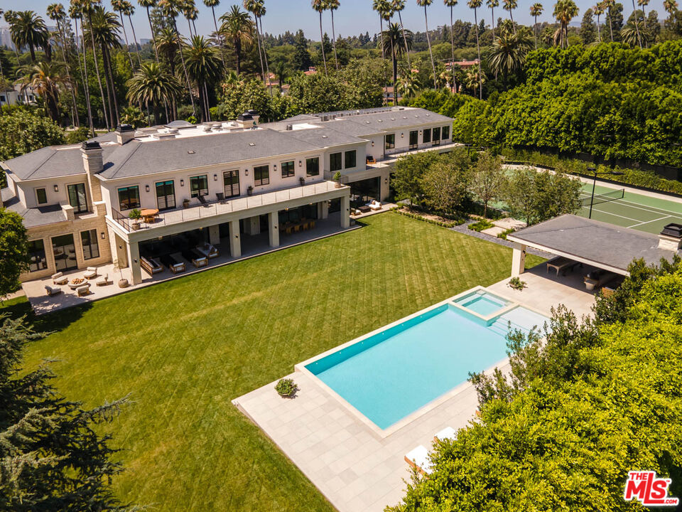 an aerial view of a house with swimming pool