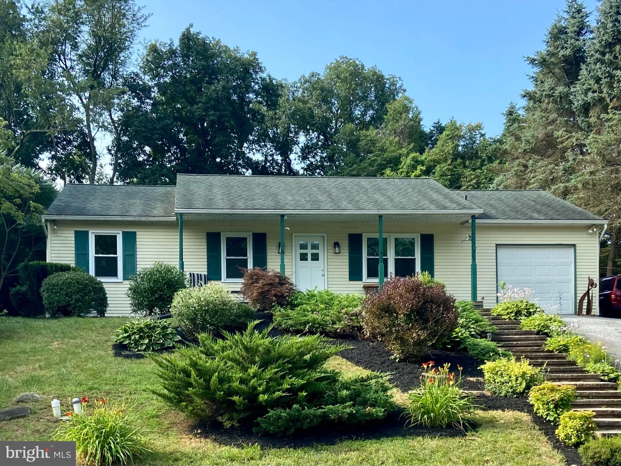 front view of a house with a yard