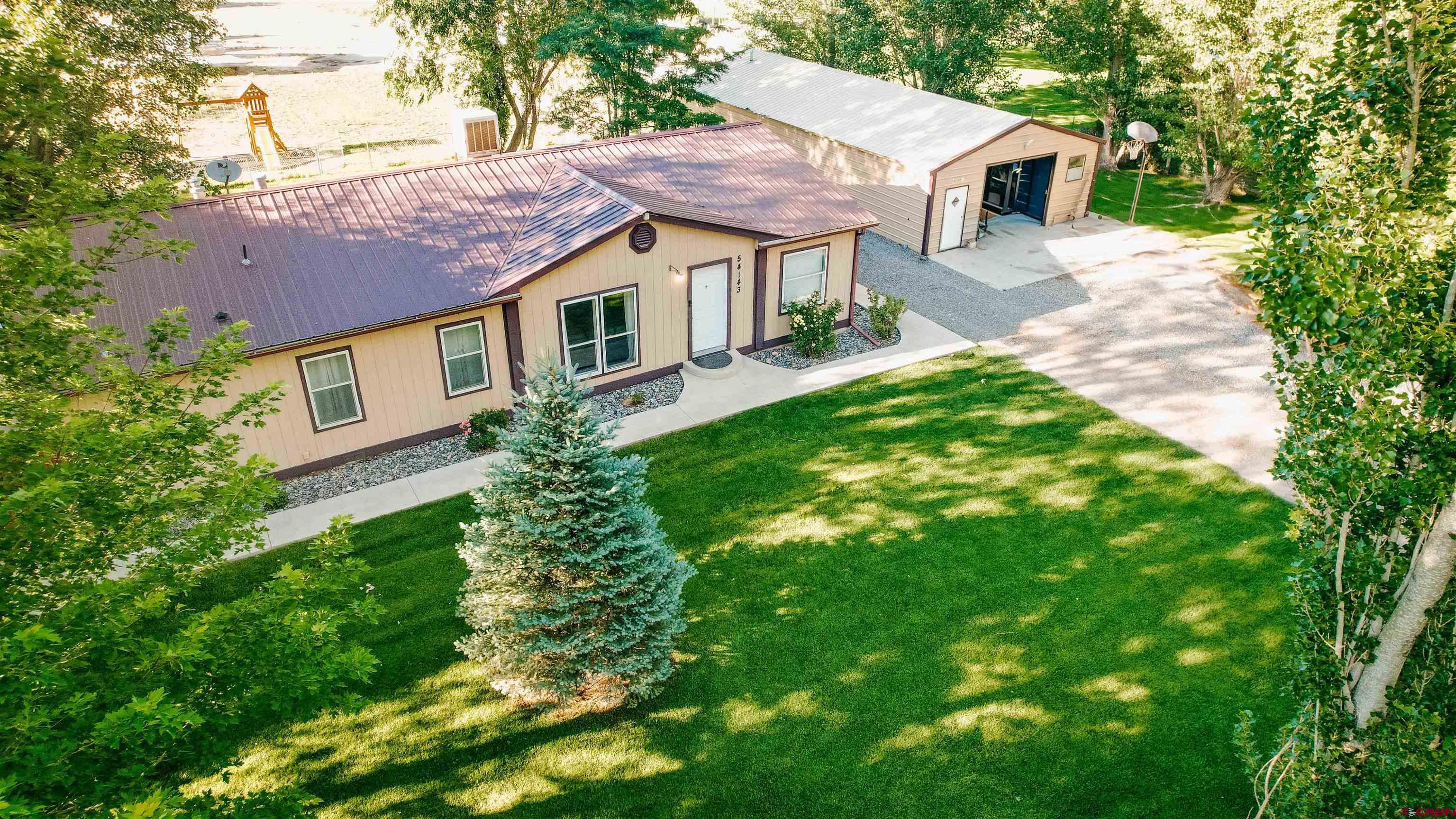 a aerial view of a house with a yard