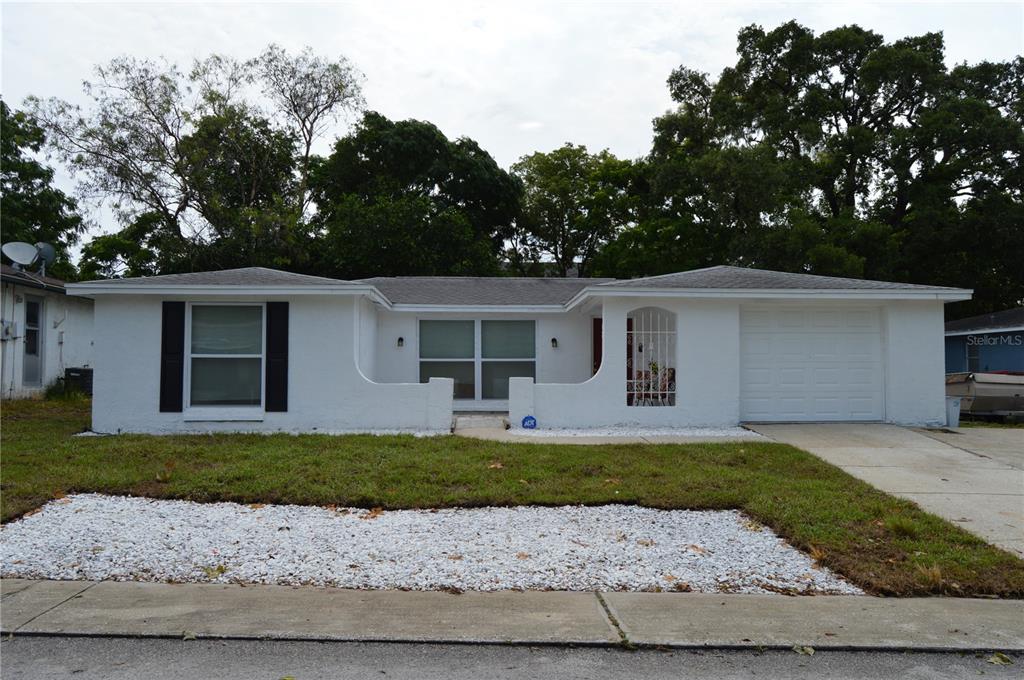 front view of a house with a yard