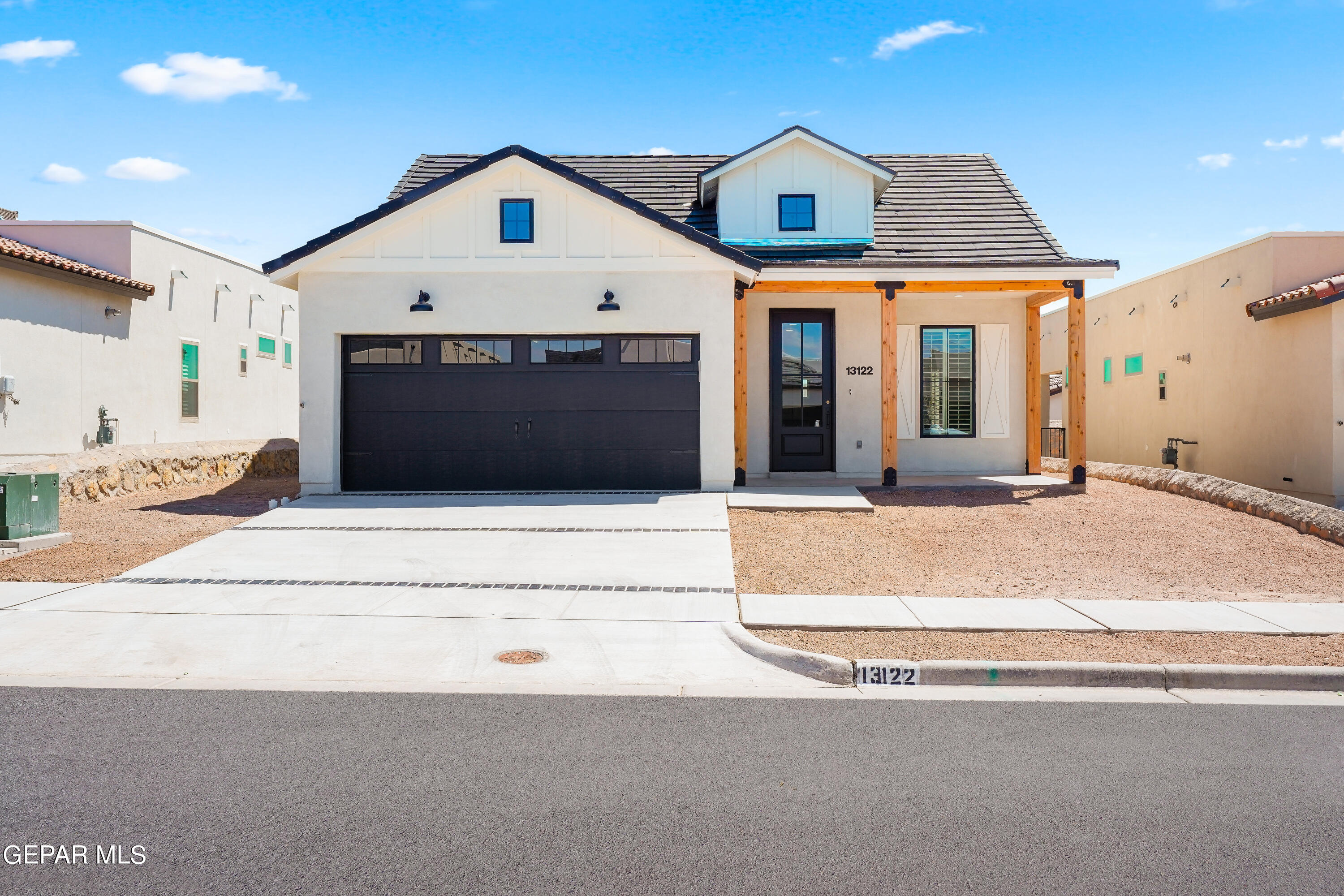 a front view of a house with a garage