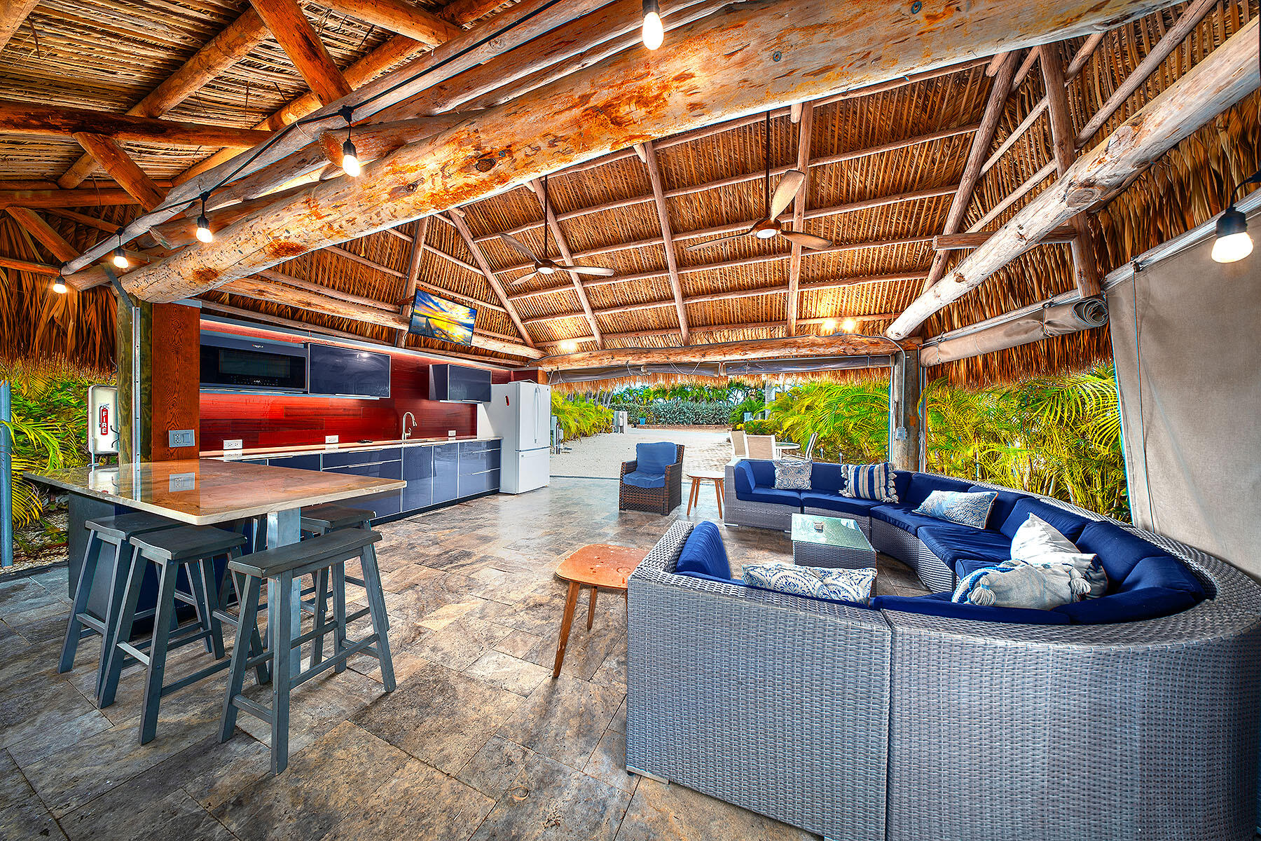 a roof deck with table and chairs