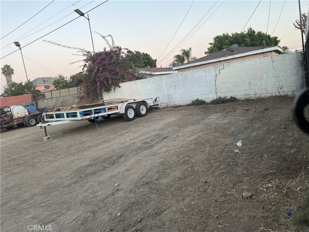 a view of a car park in front of a house