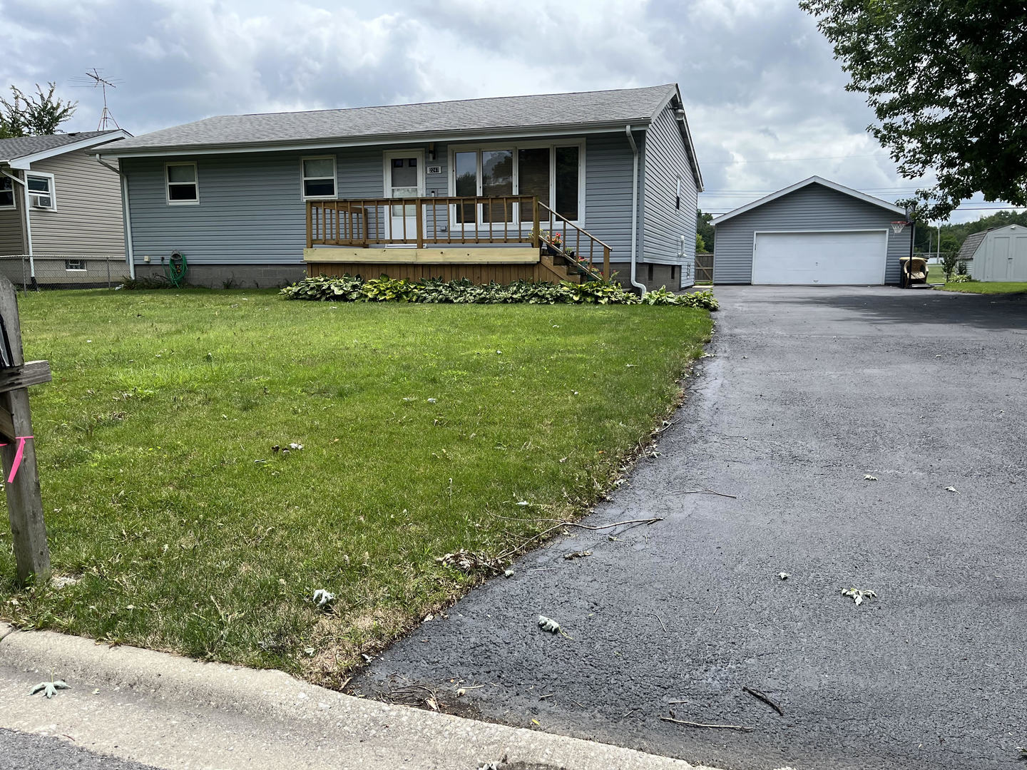 a view of house with a yard