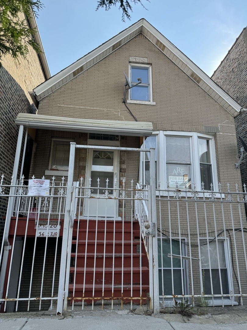 a front view of a house with glass windows