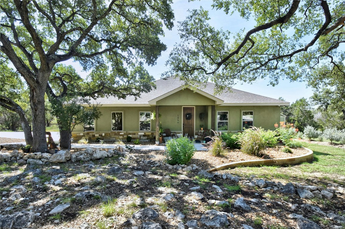 a front view of a house with garden